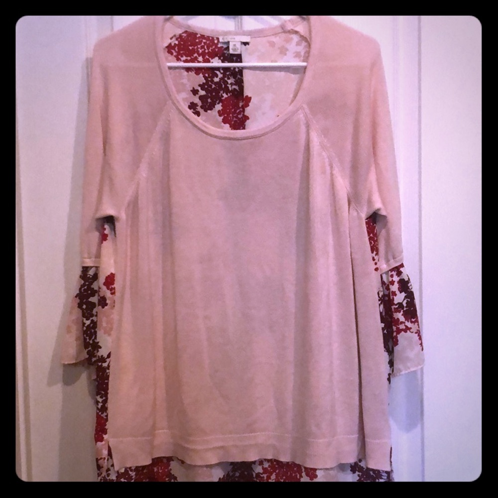 Pink top with 3/4 sleeve with floral pattern